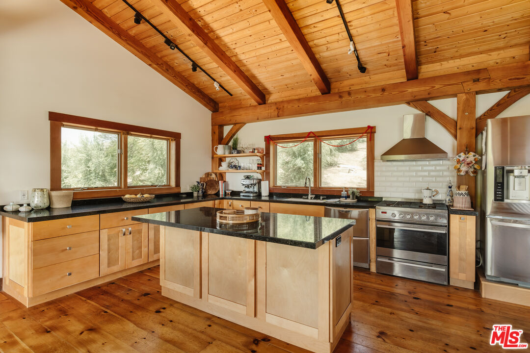 15101 Middle Ranch Road Moorpark, CA 93021 - Photo 8 of 28 a kitchen with granite countertop a sink and stainless steel appliances