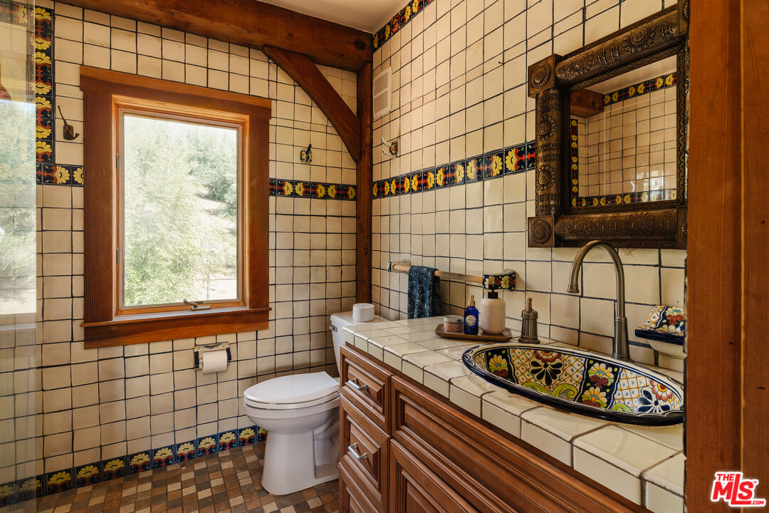 15101 Middle Ranch Road Moorpark, CA 93021 - Photo 10 of 28 a bathroom with a sink a toilet and a shower