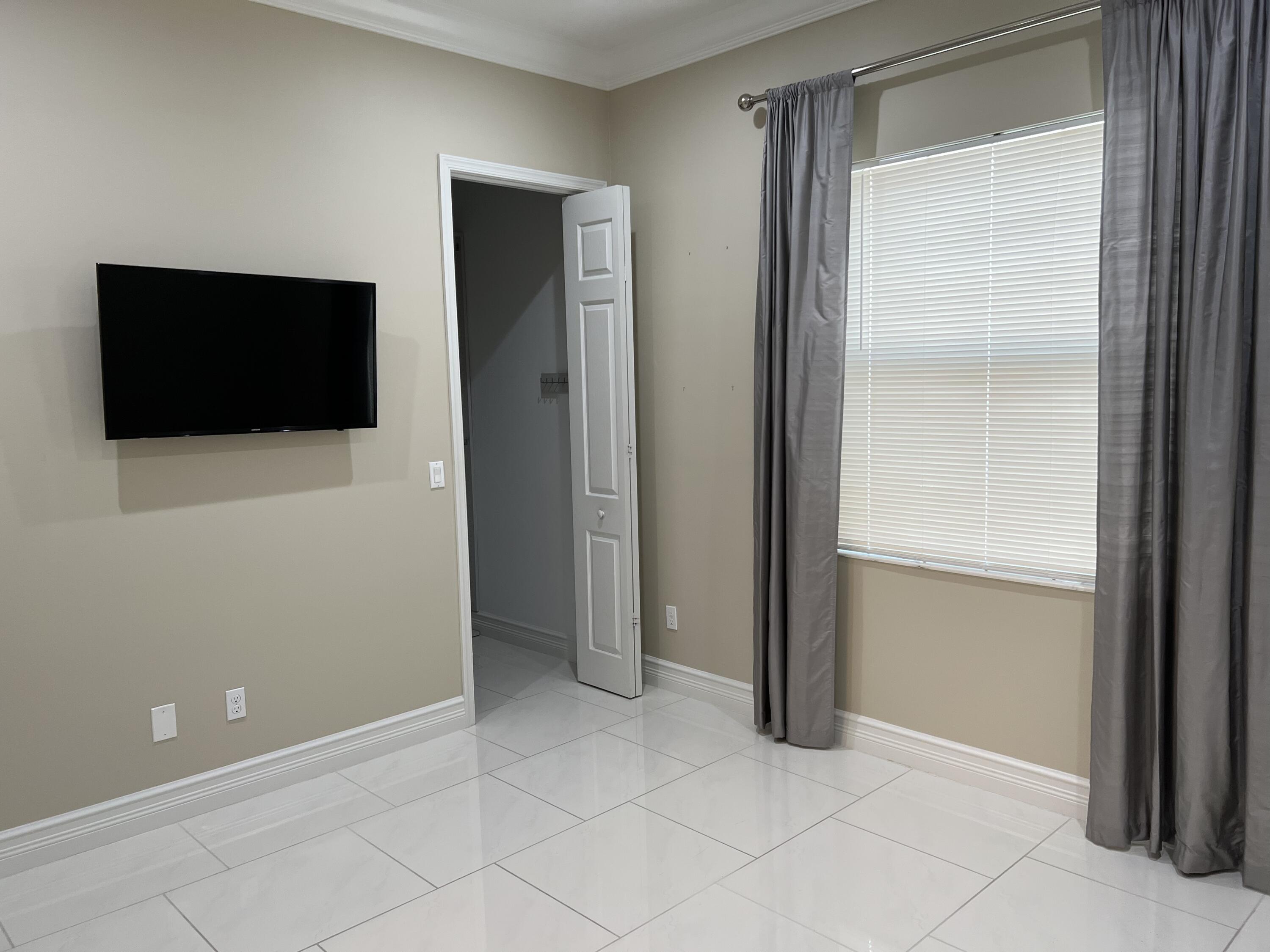 8375 Cloud Peak Drive Boynton Beach, FL 33473 - Photo 18 of 51 a view of a livingroom with an empty space and a window