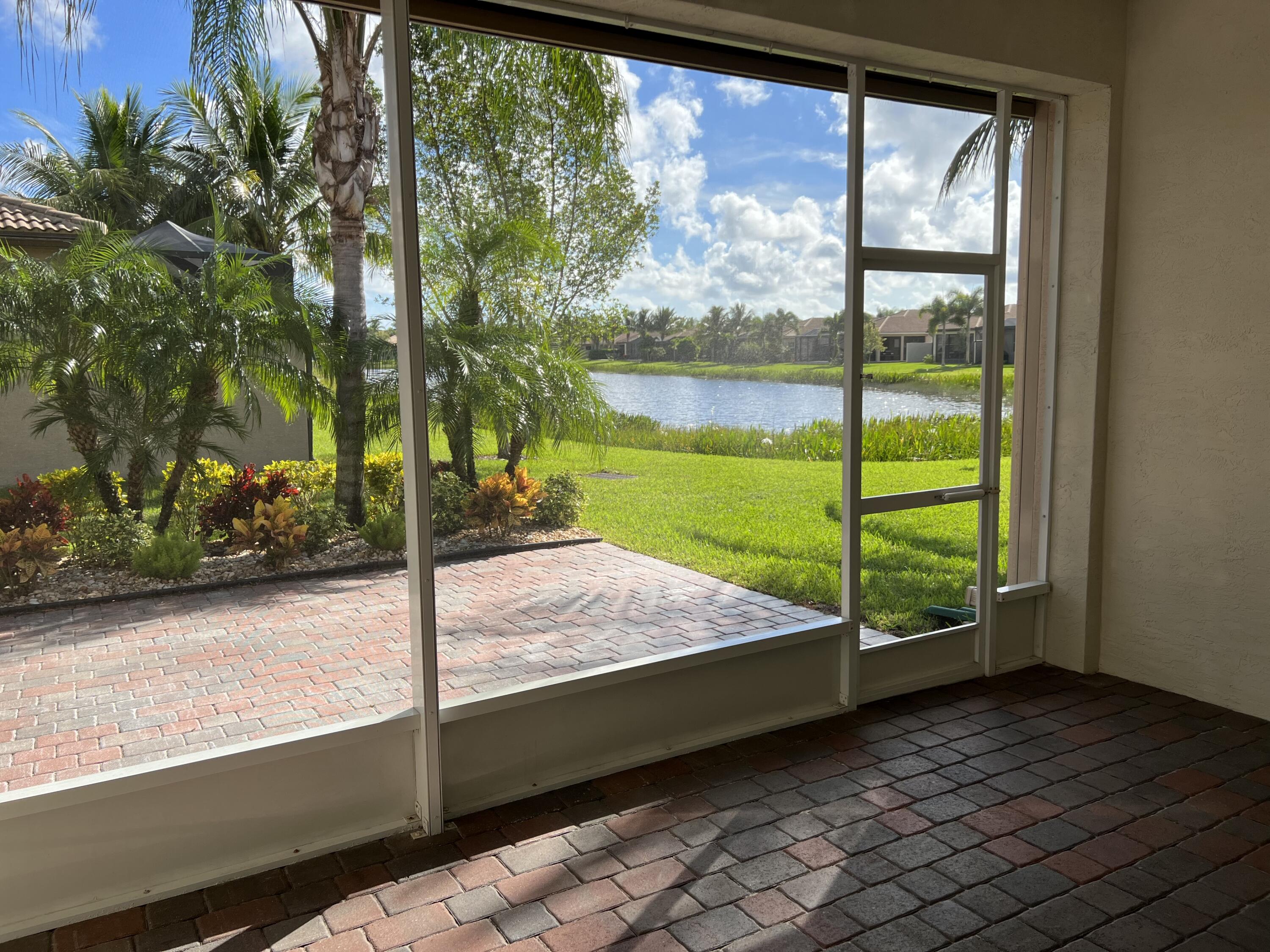 8375 Cloud Peak Drive Boynton Beach, FL 33473 - Photo 24 of 51 a bed sitting in a bedroom next to a window