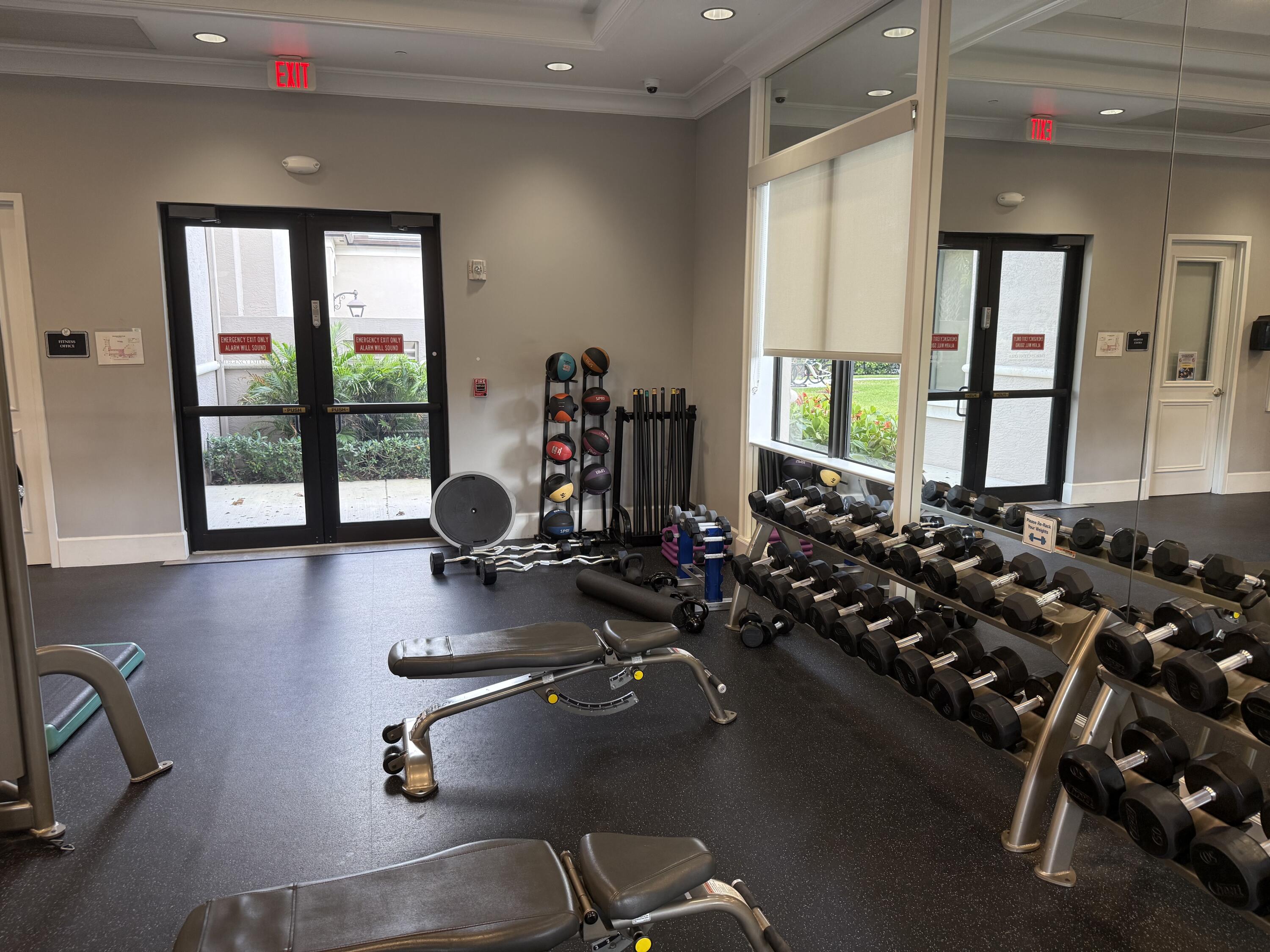 8375 Cloud Peak Drive Boynton Beach, FL 33473 - Photo 40 of 51 a room with gym equipment and a large window