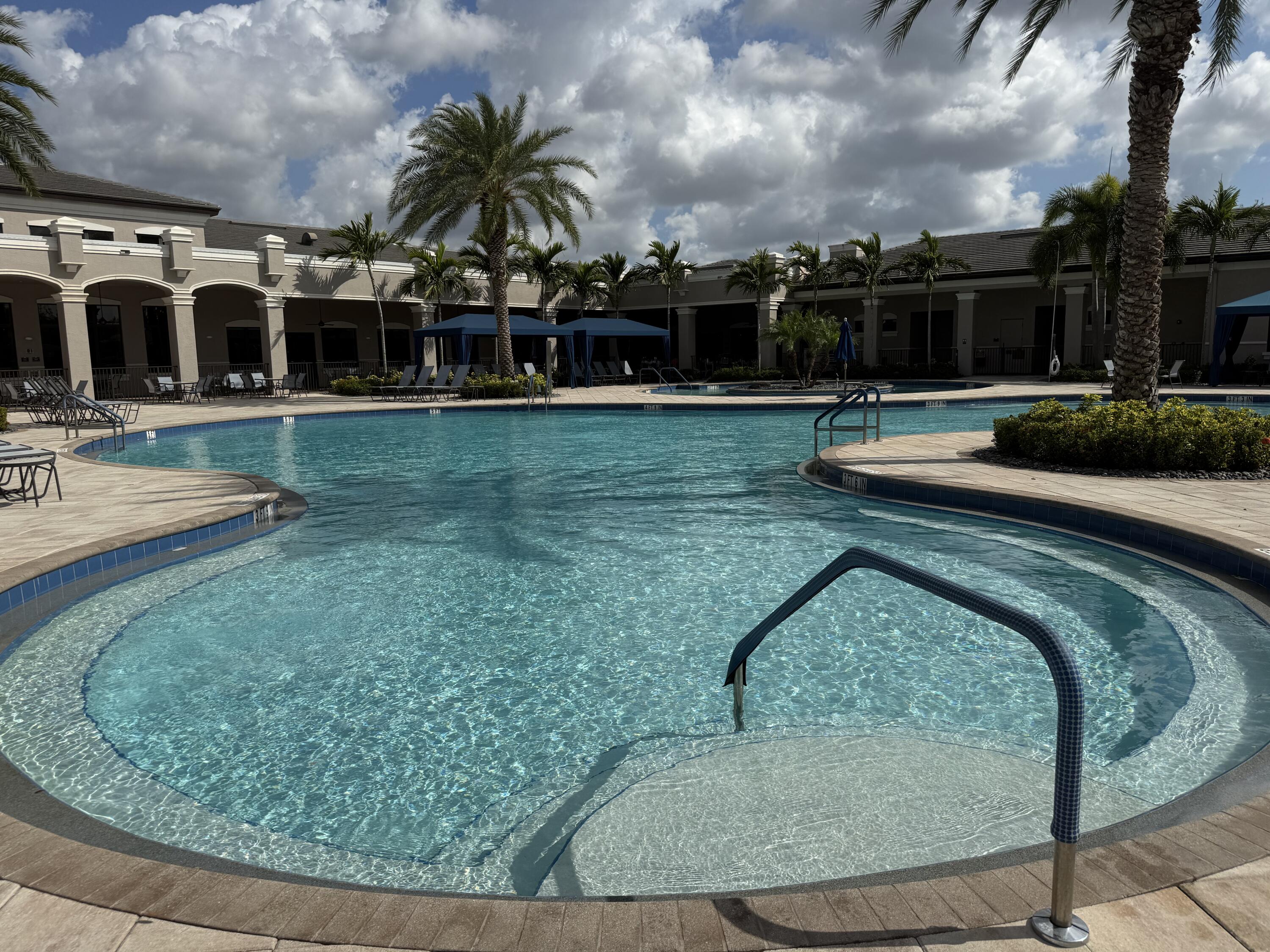 8375 Cloud Peak Drive Boynton Beach, FL 33473 - Photo 44 of 51 a view of a house with a swimming pool