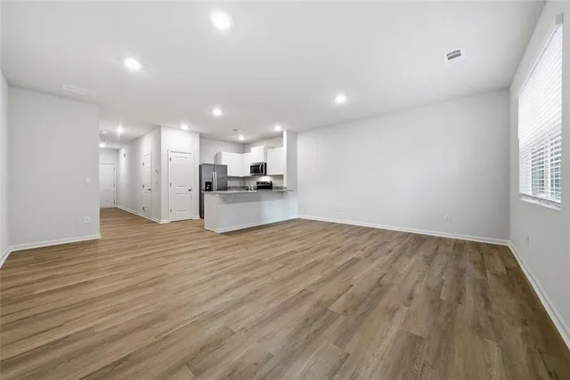 a view of a kitchen electric appliances and cabinets