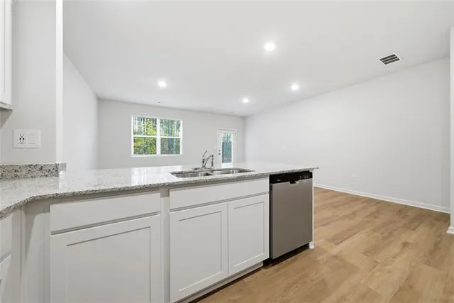 a kitchen with sink and window
