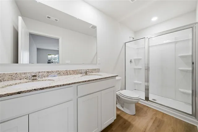 a bathroom with a shower and toilet