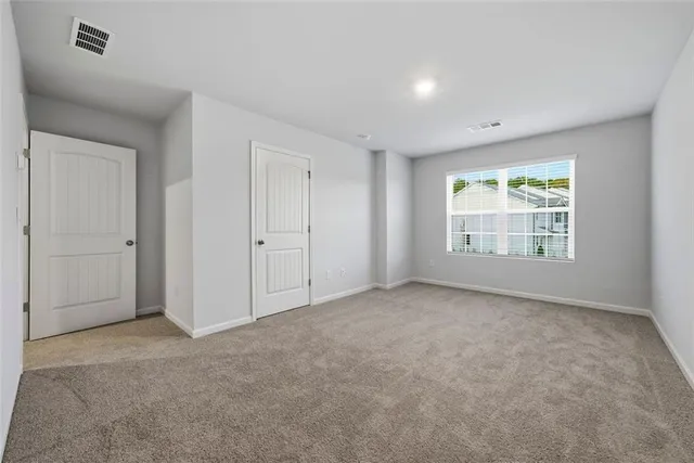 wooden floor with white cabinets