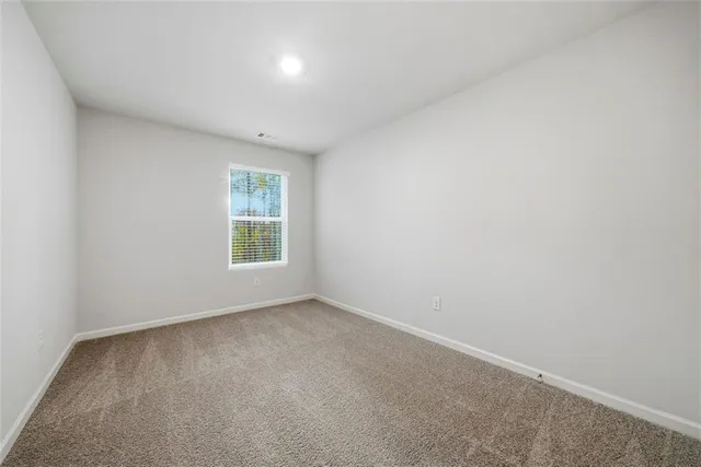a bathroom with a sink toilet vanity and shower