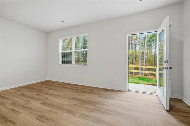a view of an empty room with a window
