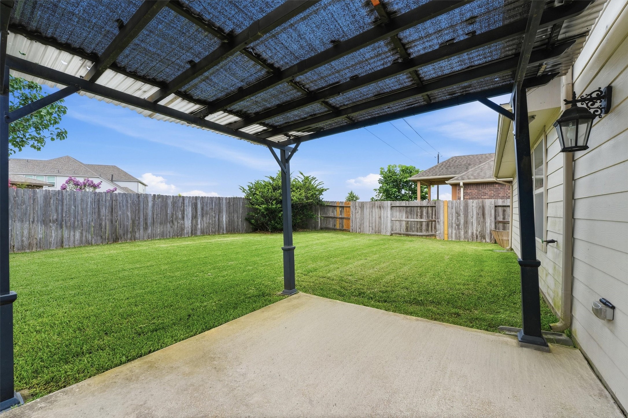 1911 Cedar Ridge Lane Pearland, TX 77089 - Photo 23 of 33 The pergola-covered patio creates the perfect spot for morning coffee or evening gatherings.