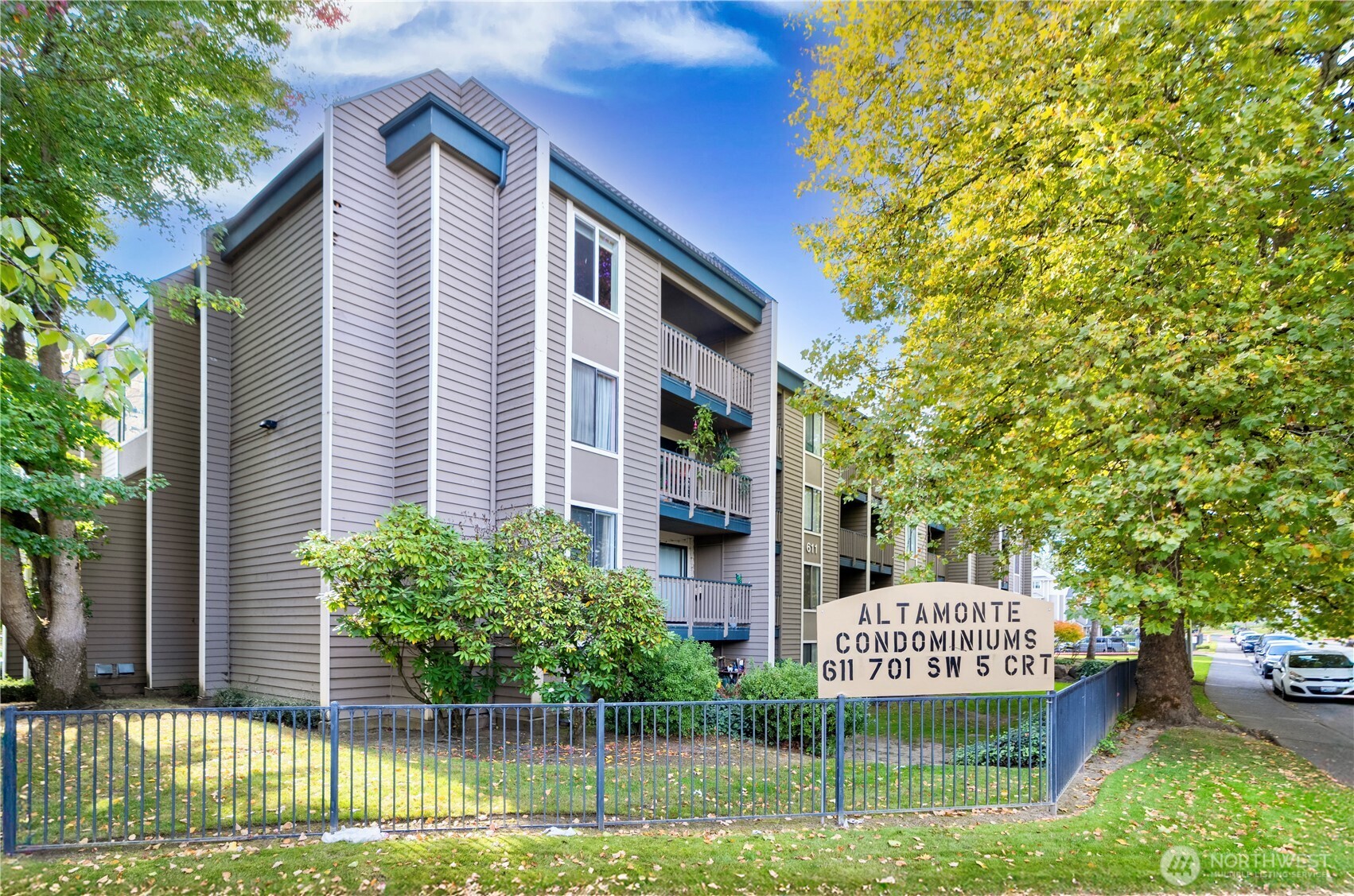 611 Southwest 5th Court, Unit A206 Renton, WA 98057 - Photo 1 of 21 a front view of a house with a garden and plants