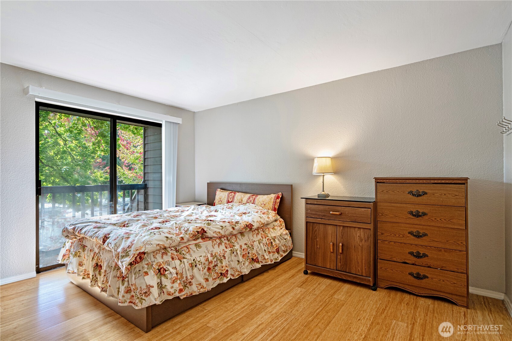 611 Southwest 5th Court, Unit A206 Renton, WA 98057 - Photo 12 of 21 a bedroom with a bed and a dresser