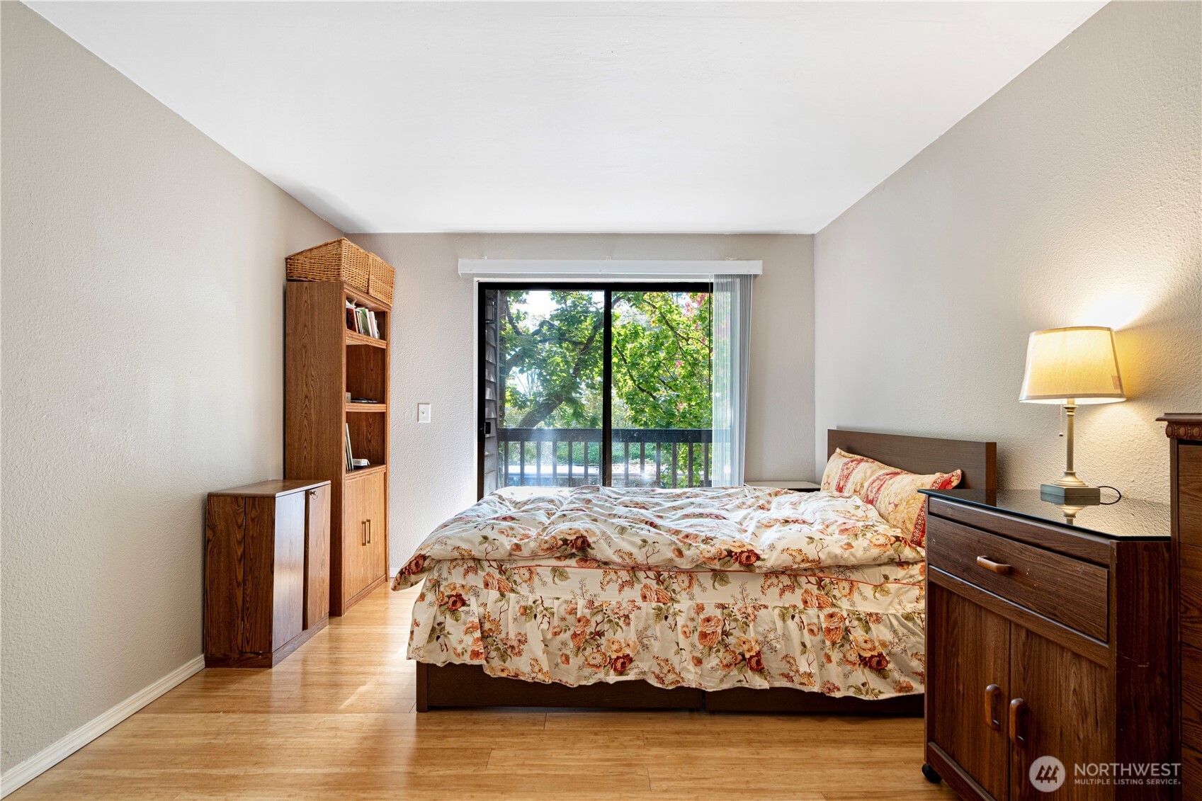 611 Southwest 5th Court, Unit A206 Renton, WA 98057 - Photo 13 of 21 a bedroom with a bed and wooden floor