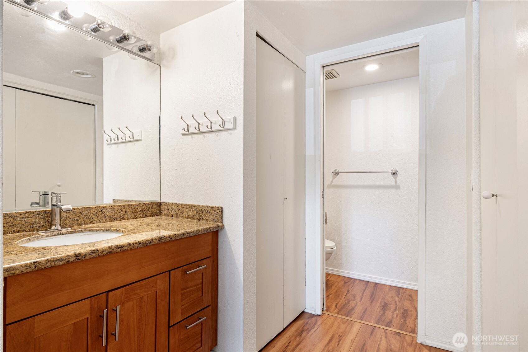 611 Southwest 5th Court, Unit A206 Renton, WA 98057 - Photo 15 of 21 a bathroom with a sink and a mirror