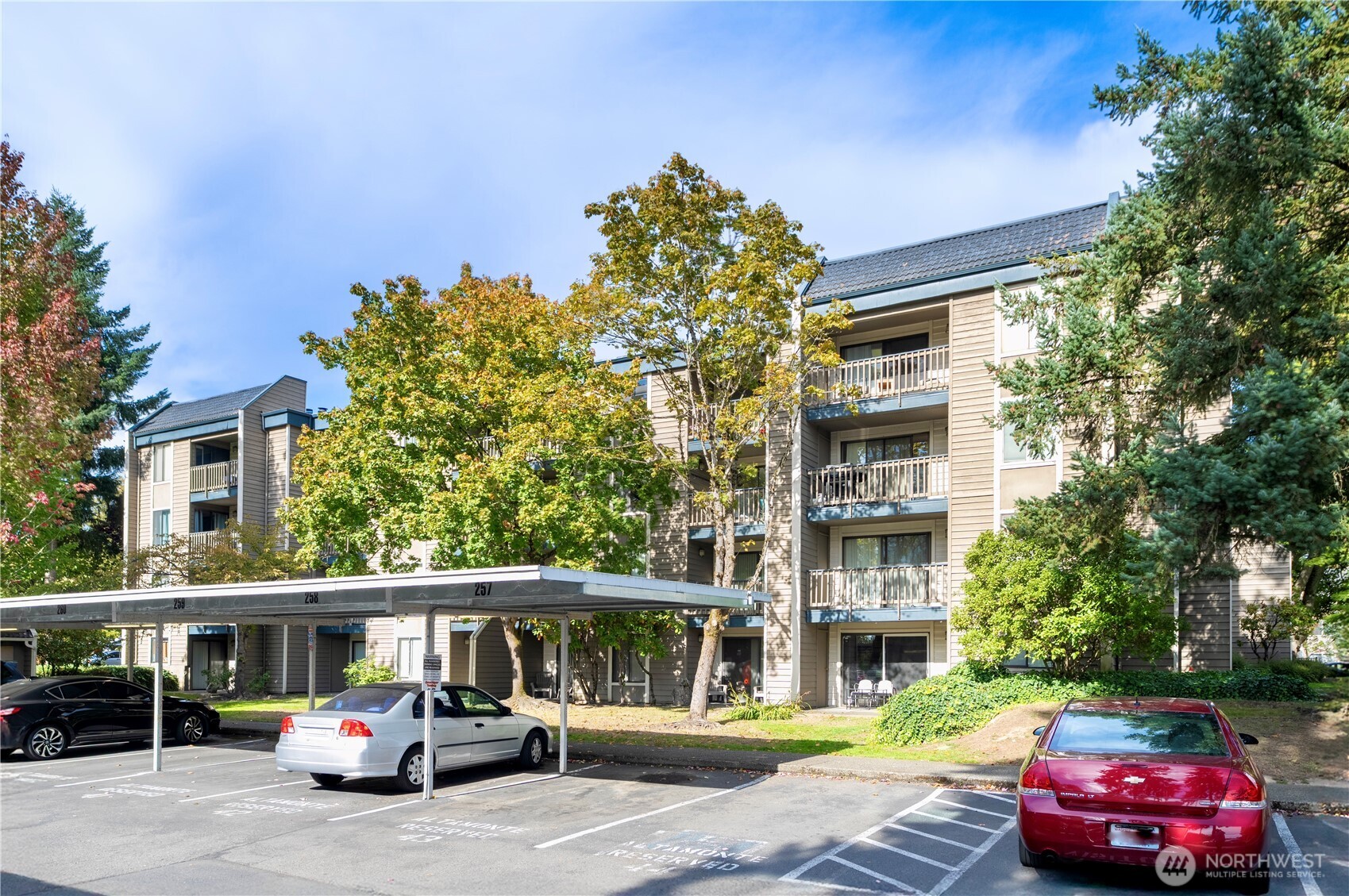 611 Southwest 5th Court, Unit A206 Renton, WA 98057 - Photo 20 of 21 a car parked in front of a building