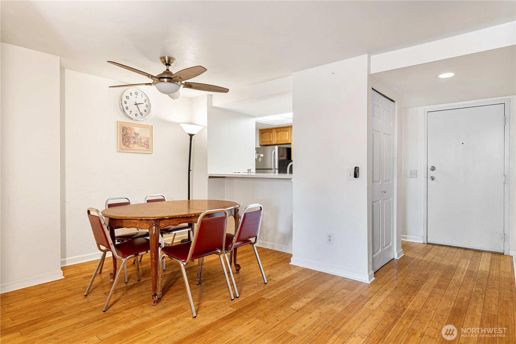 611 Southwest 5th Court, Unit A206 Renton, WA 98057 - Photo 5 of 21 a view of a dining room with furniture and wooden floor