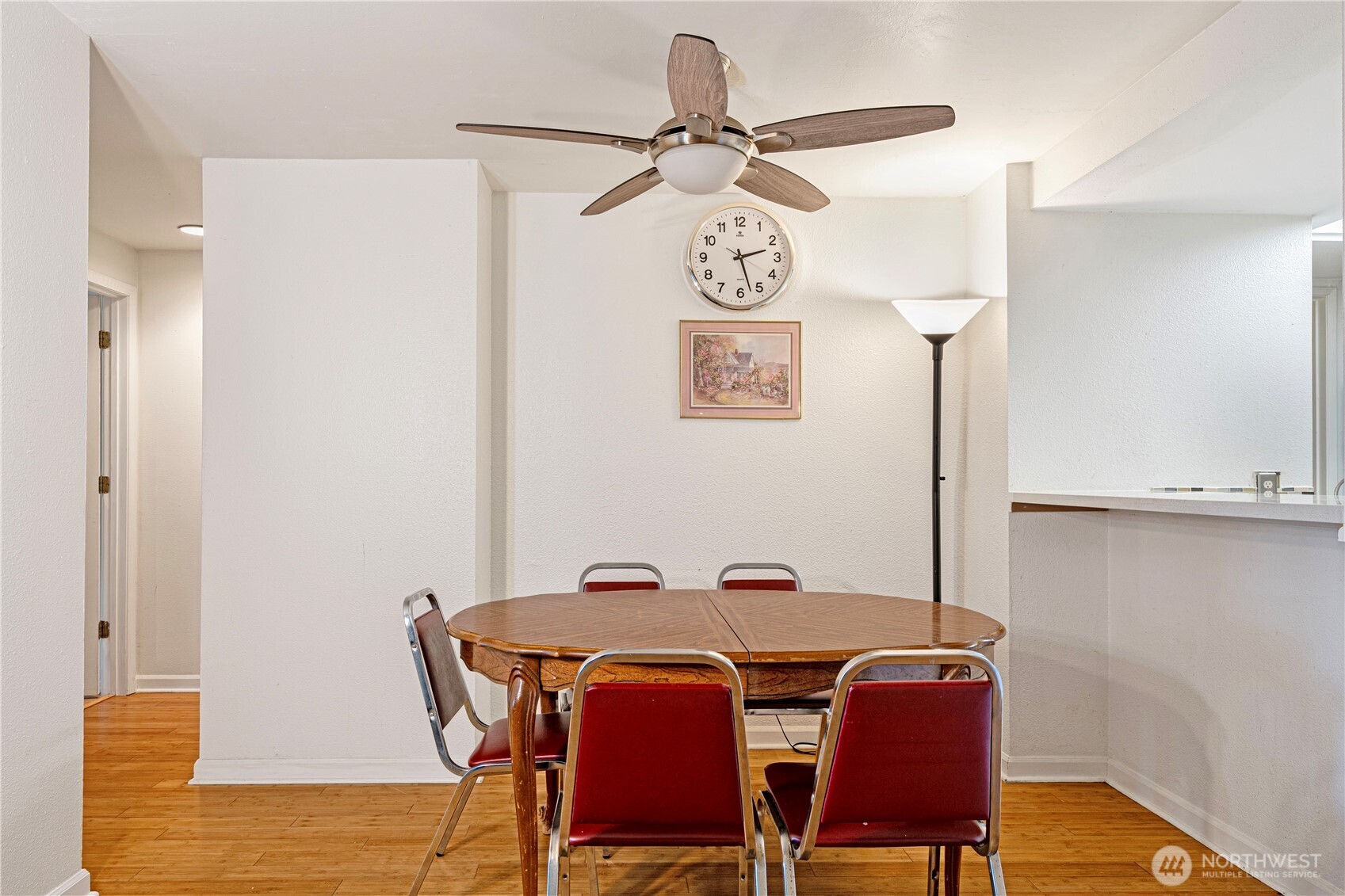 611 Southwest 5th Court, Unit A206 Renton, WA 98057 - Photo 6 of 21 a view of a dining room with furniture and wooden floor