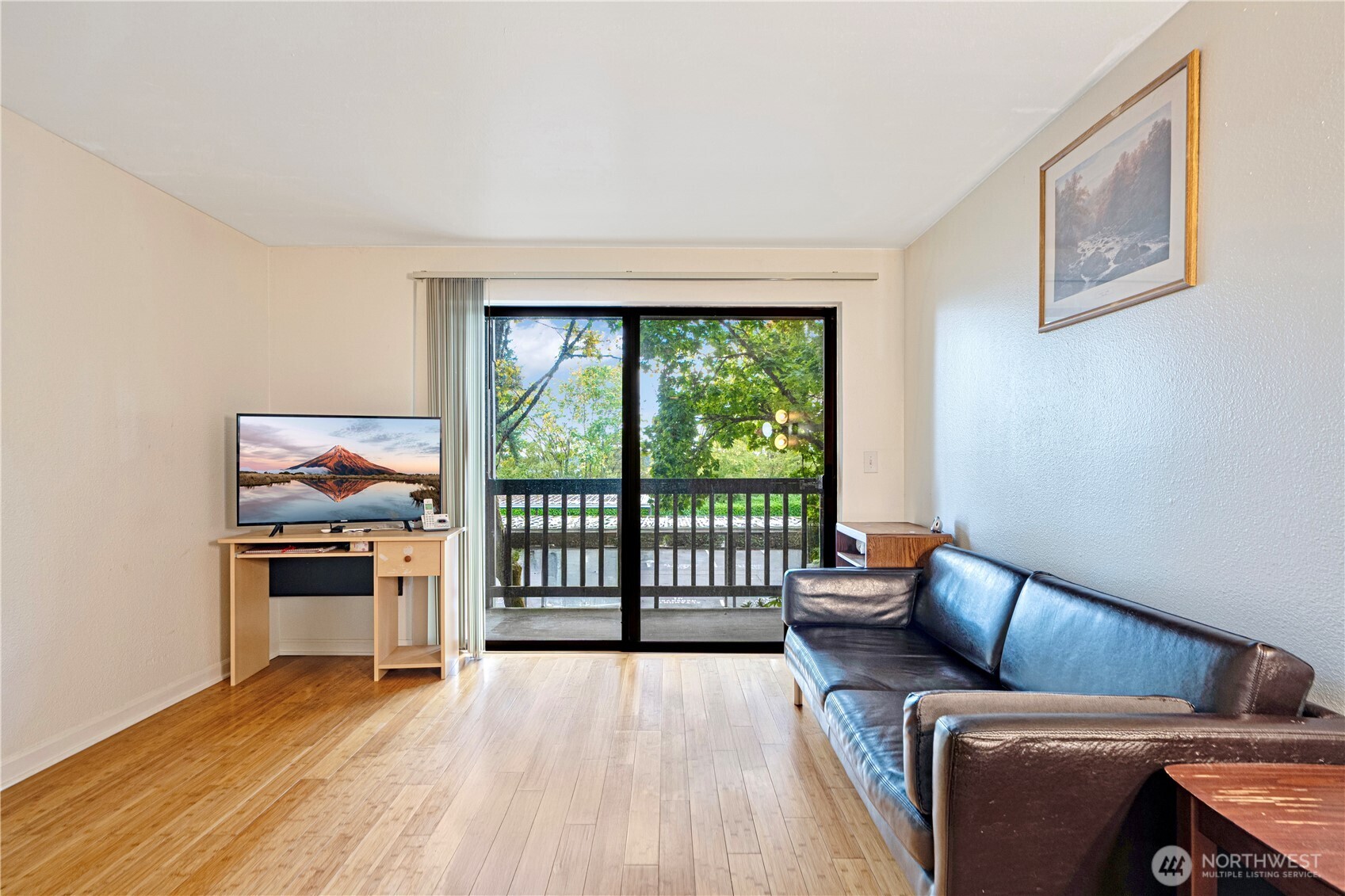 611 Southwest 5th Court, Unit A206 Renton, WA 98057 - Photo 7 of 21 a living room with furniture and a floor to ceiling window