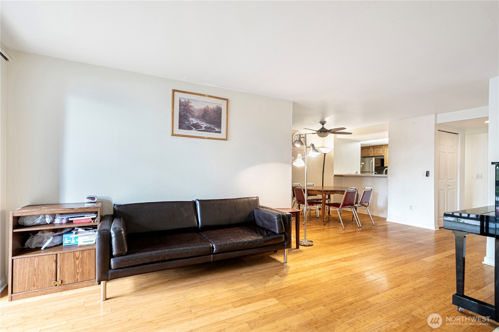 611 Southwest 5th Court, Unit A206 Renton, WA 98057 - Photo 8 of 21 a living room with furniture and a flat screen tv