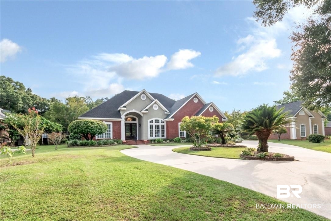 8837 Dawes Lake Road South Mobile, AL 36619 - Photo 40 of 44 View of front of property with a garage and a front lawn
