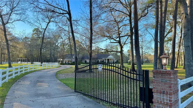 a bedroom with bed and a chandelier
