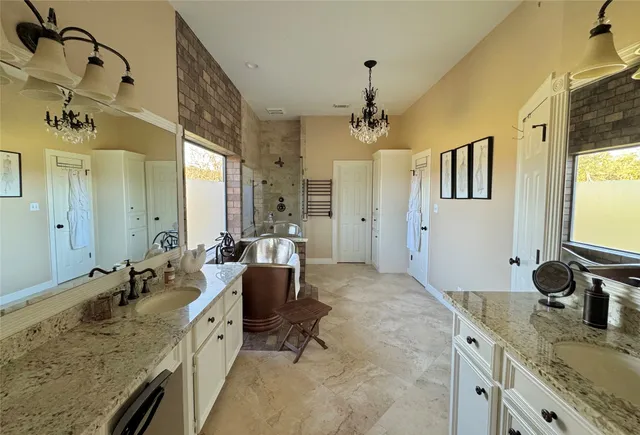 a view of sink sitting area with granite countertop