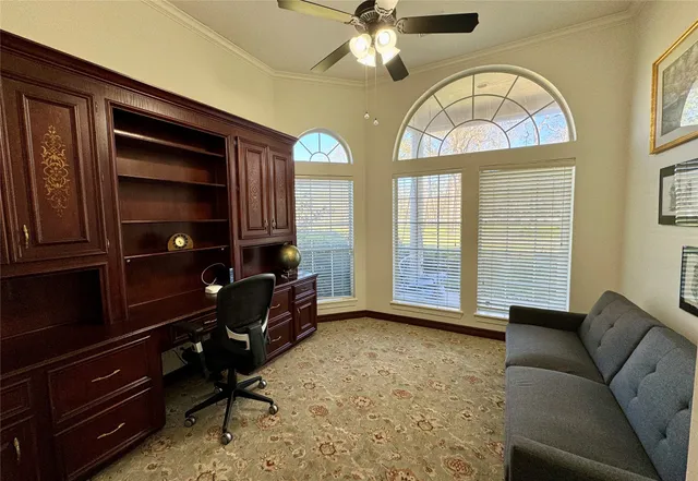 a living room with furniture kitchen view and a chandelier