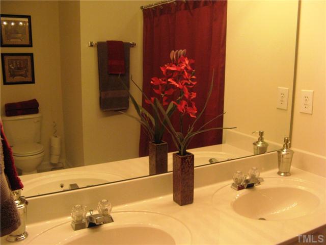 4928 Wyatt Brook Way Raleigh, NC 27609 - Photo 10 of 14 Your first master bath has dual vanities and a garden tub/shower.