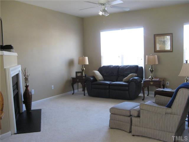 4928 Wyatt Brook Way Raleigh, NC 27609 - Photo 5 of 14 To the right of the dining area is your ample sized Family room. A special angled wall for the gas log fireplace and your TV add warmth and character to this area.