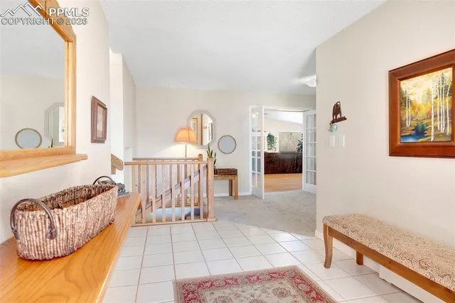 a living room with furniture and a rug