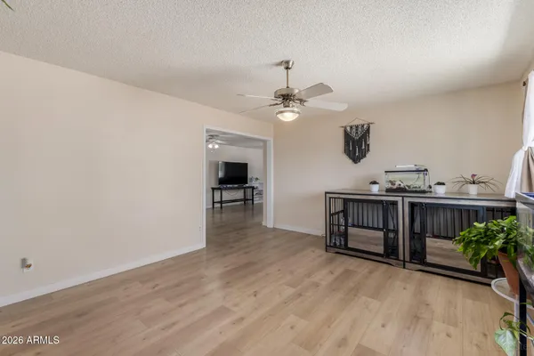 a view of a livingroom with furniture and a ceiling fan