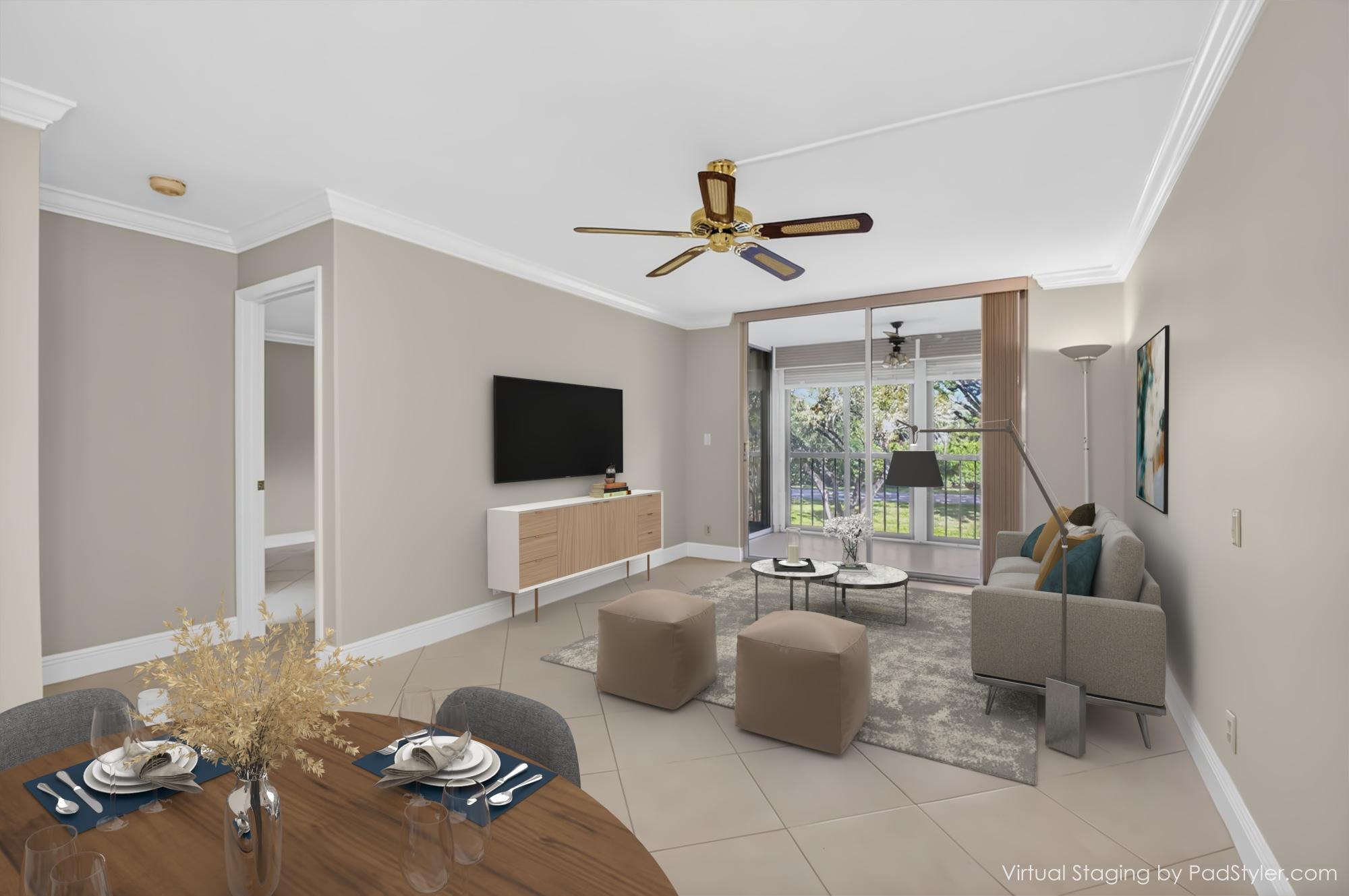 6935 Huntington Lane, Unit 207 Delray Beach, FL 33446 - Photo 16 of 88 a living room with furniture and a flat screen tv