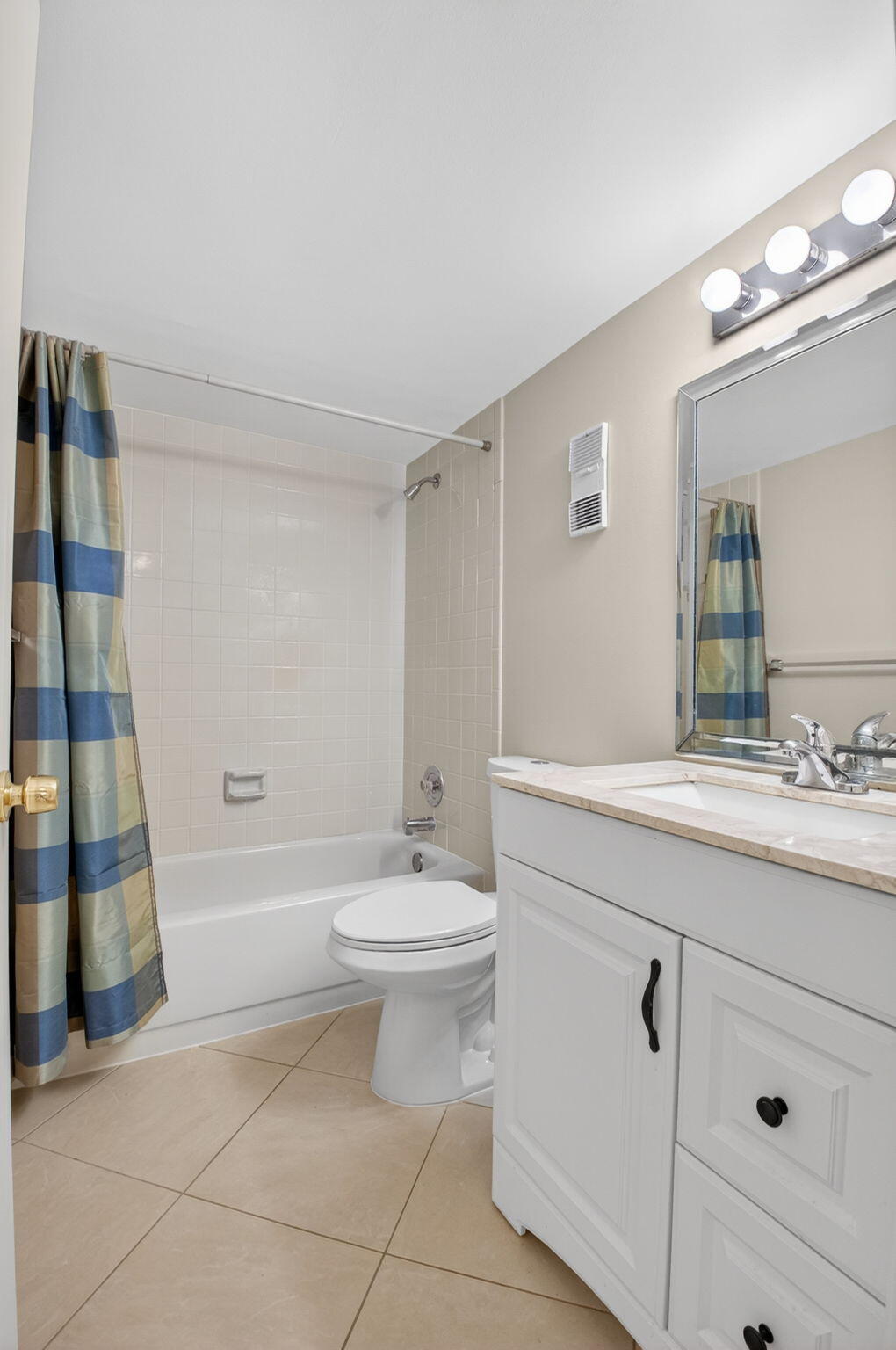 6935 Huntington Lane, Unit 207 Delray Beach, FL 33446 - Photo 35 of 88 a bathroom with a double vanity sink toilet and shower