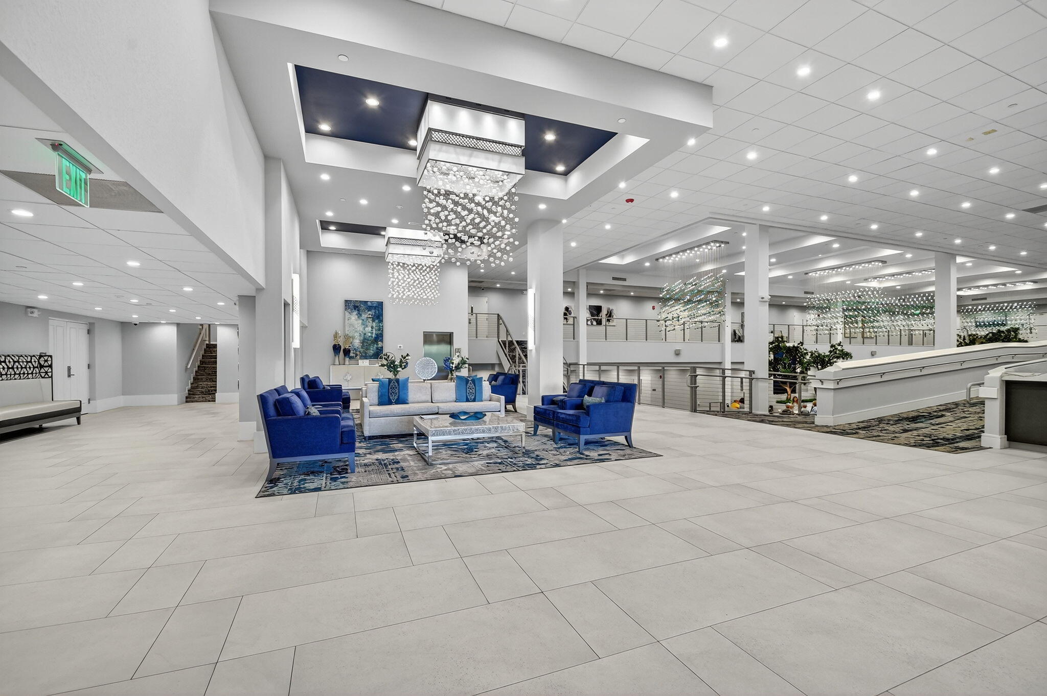 6935 Huntington Lane, Unit 207 Delray Beach, FL 33446 - Photo 39 of 88 a living room with lots of furniture and a chandelier