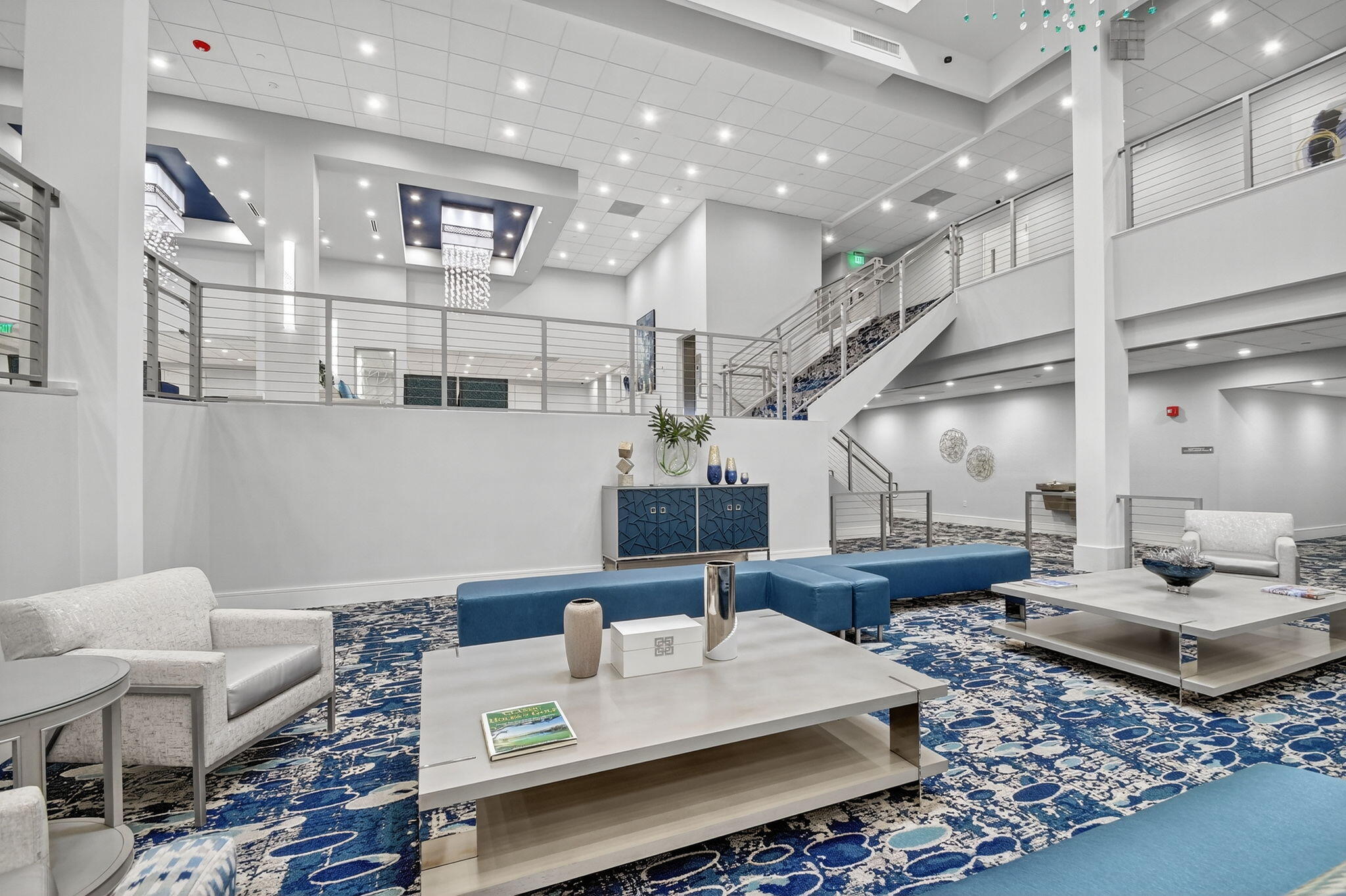 6935 Huntington Lane, Unit 207 Delray Beach, FL 33446 - Photo 46 of 88 a living room with furniture and a chandelier