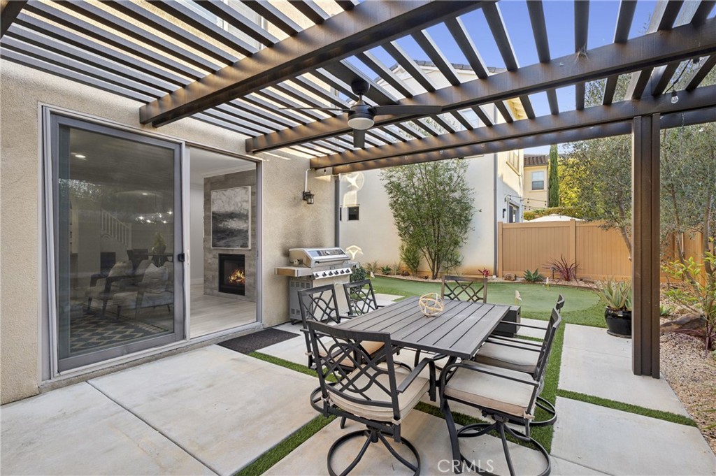 28274 Camino Del Rio San Juan Capistrano, CA 92675 - Photo 13 of 30 a patio with a table and chairs and couches with wooden floor and fence
