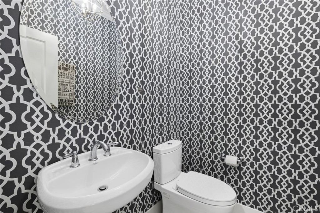 28274 Camino Del Rio San Juan Capistrano, CA 92675 - Photo 14 of 30 a bathroom with a sink and a toilet