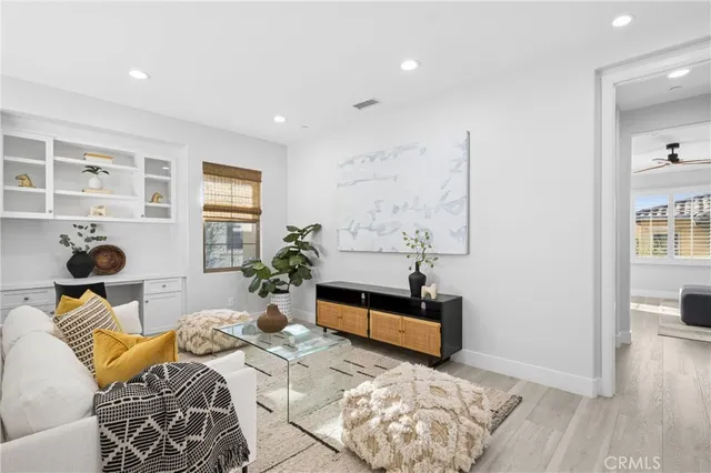 a bedroom with furniture and a potted plant