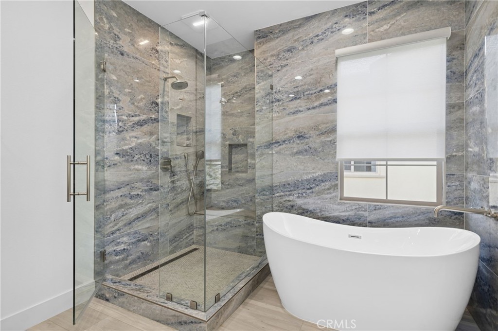 28274 Camino Del Rio San Juan Capistrano, CA 92675 - Photo 20 of 30 a bathroom with a bathtub and shower