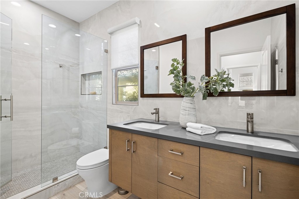 28274 Camino Del Rio San Juan Capistrano, CA 92675 - Photo 23 of 30 a bathroom with a granite countertop sink mirror and toilet