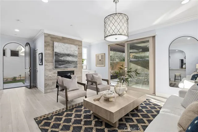 a living room with patio bathtub and a chandelier