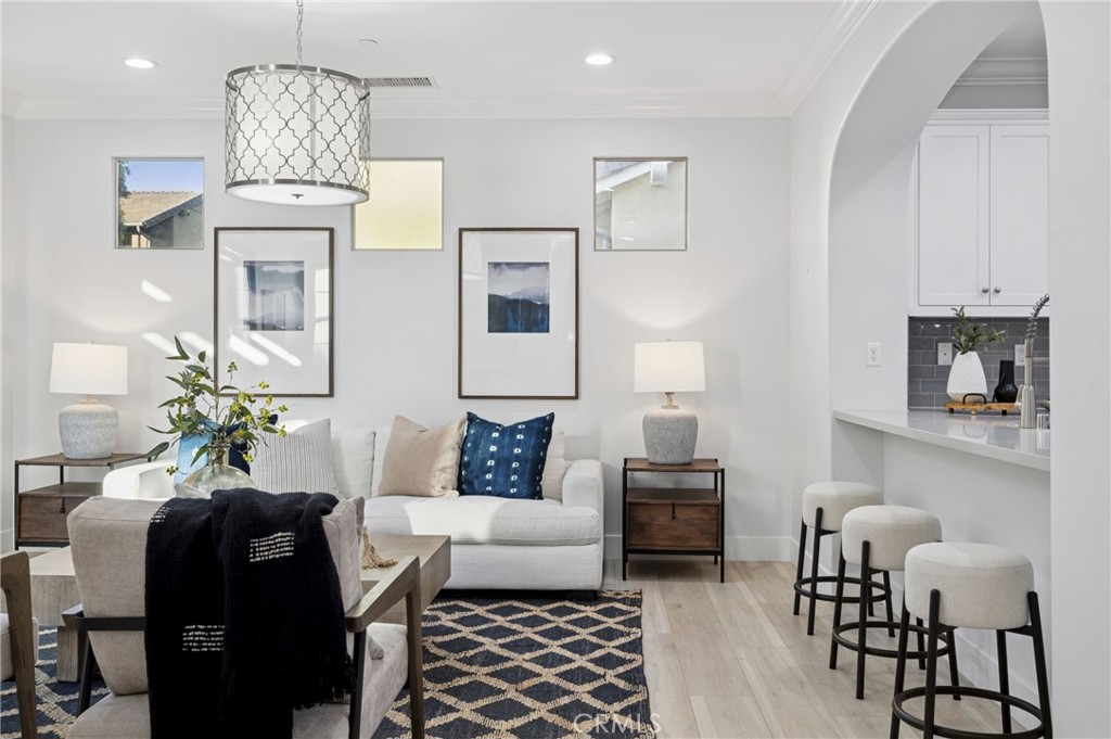 28274 Camino Del Rio San Juan Capistrano, CA 92675 - Photo 5 of 30 a living room with furniture and a chandelier