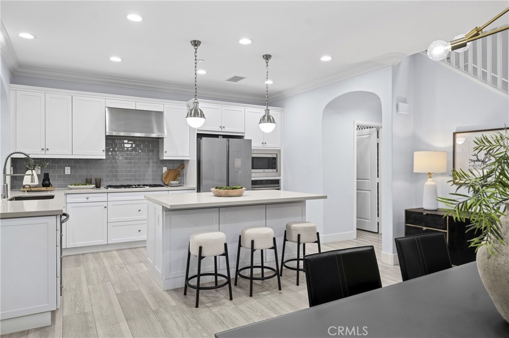 28274 Camino Del Rio San Juan Capistrano, CA 92675 - Photo 8 of 30 a kitchen with cabinets and wooden floor