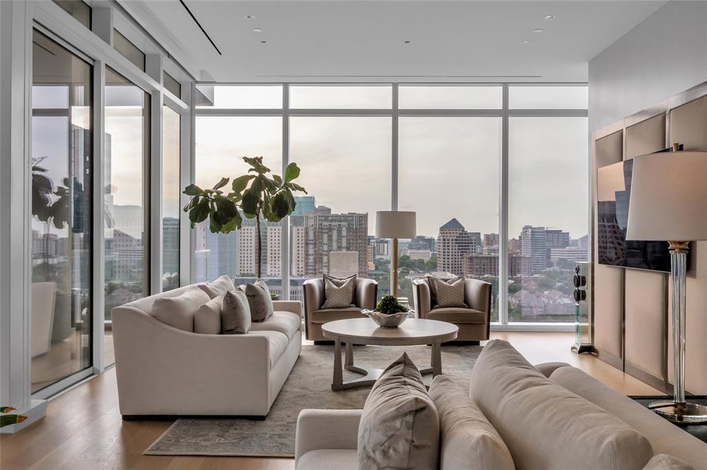 1747 Leonard Street, Unit 1402 Dallas, TX 75201 - Photo 1 of 36 a living room with furniture and a large window