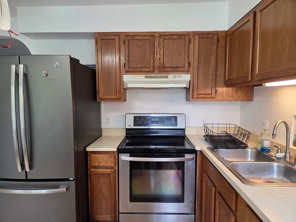 920 Worcester Road Barre, MA 01005 - Photo 20 of 40 a kitchen with stainless steel appliances wooden cabinets sink and a stove