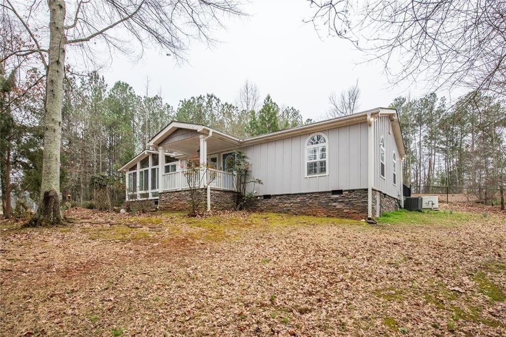3819 Mason Creek Road Winston, GA 30187 - Photo 35 of 54 a view of a house with a yard