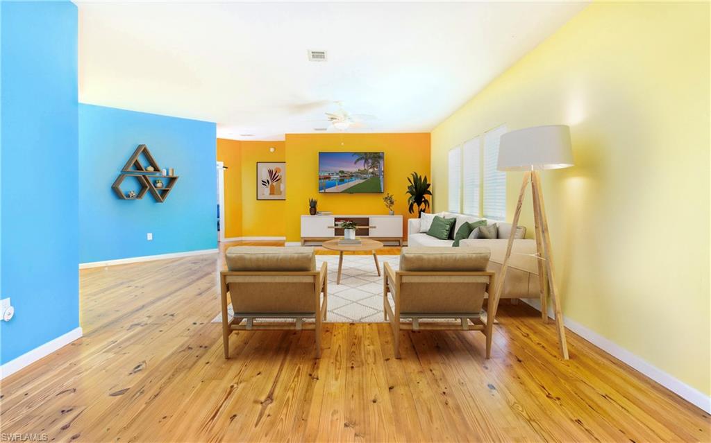 12277 Boat Shell Drive Matlacha Isles, FL 33991 - Photo 28 of 46 a living room with furniture and wooden floor