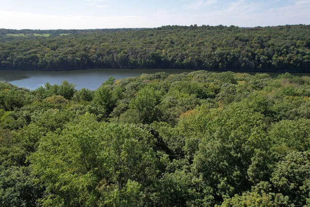 an aerial view of valley and lake