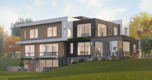 a front view of a house with a yard table and chairs