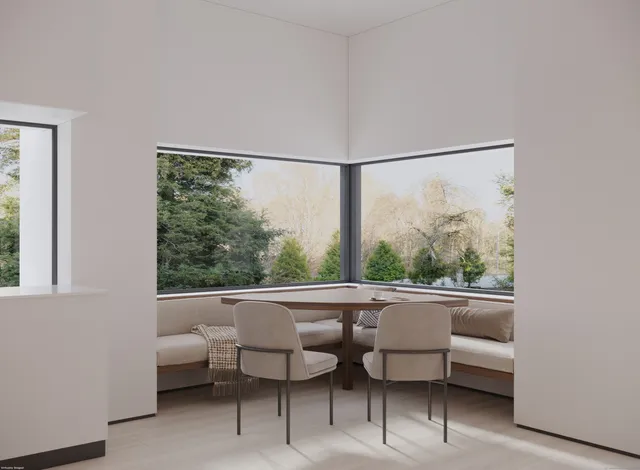 a view of a room with furniture and a window