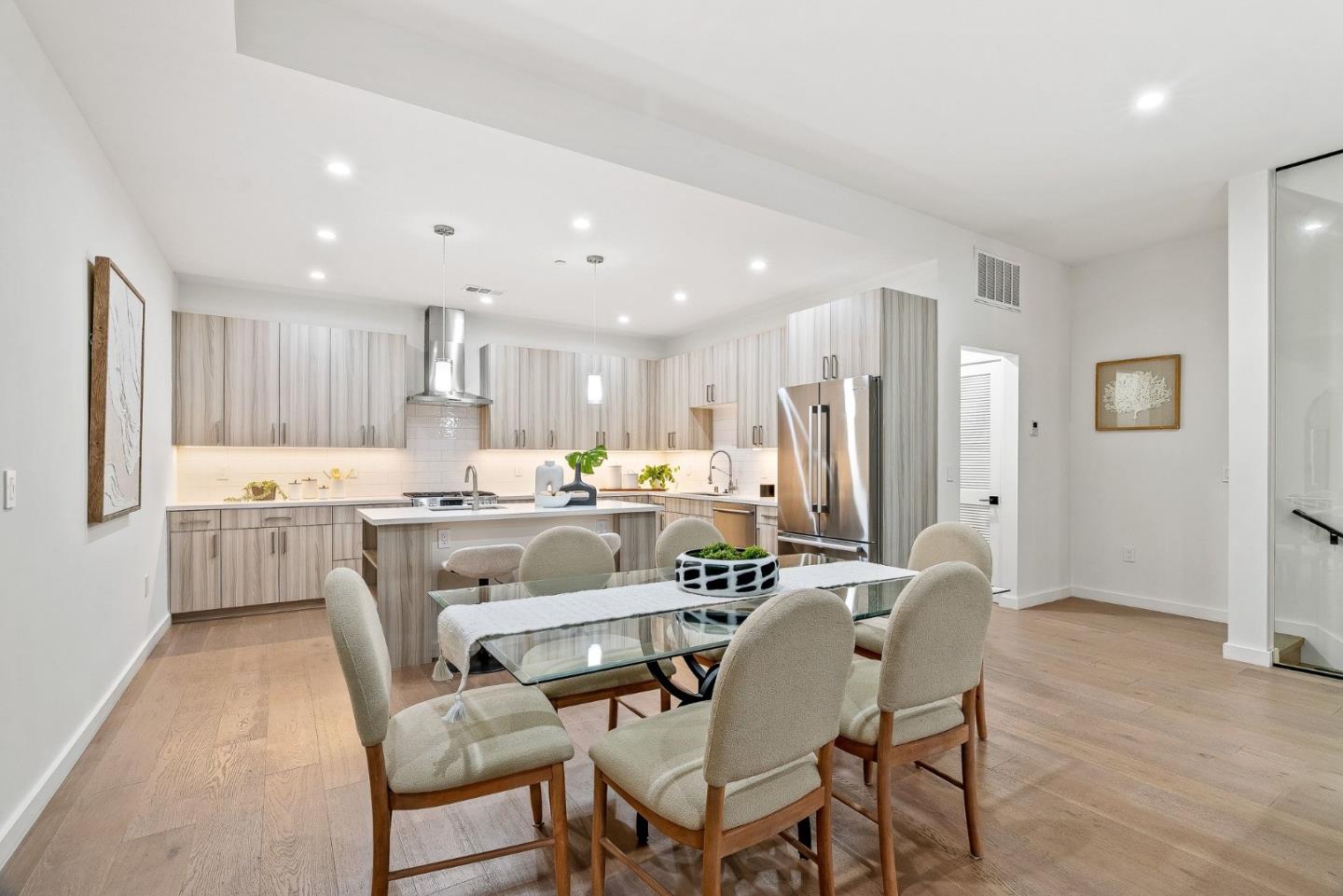 922 Woodside Road Redwood City, CA 94061 - Photo 13 of 30 a dining room with stainless steel appliances kitchen island granite countertop a dining table and chairs